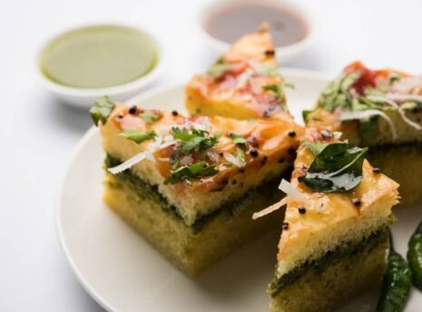 yellow-sandwich-dhokla-is-indian-savoury-snack-made-chick-pea-flour-rice-flour-originated-gujarat-served-with-green-tamarind-chutney-selective-focus_466689-58612 yellow-sandwich-dhokla-is-indian-savoury-snack-made-chick-pea-flour-rice-flour-originated-gujarat-served-with-green-tamarind-chutney-selective-focus_466689-58612