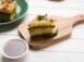 yellow-sandwich-dhokla-is-indian-savoury-snack-made-chick-pea-flour-rice-flour-originated-gujarat-served-with-green-tamarind-chutney-selective-focus_466689-58656